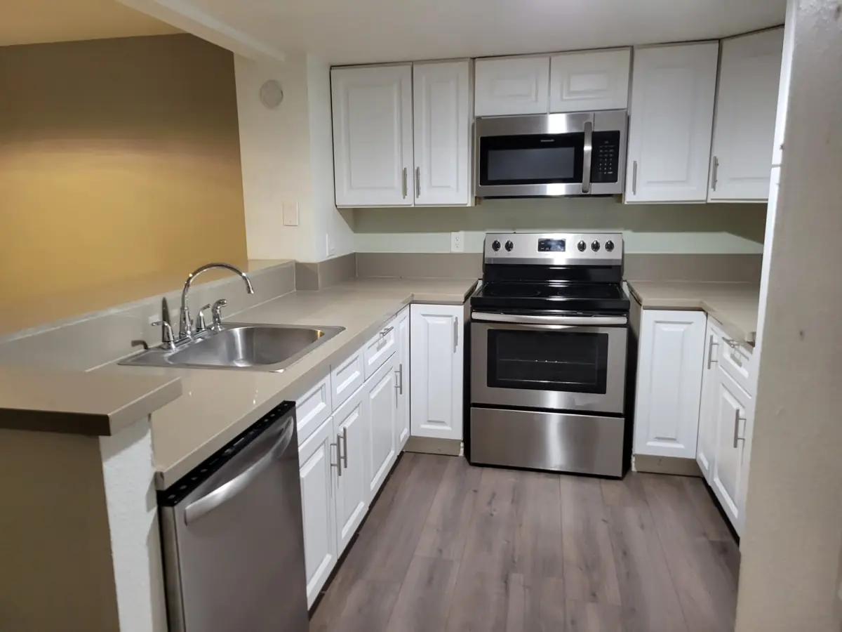 Apartment kitchen with stainless range after cleaning