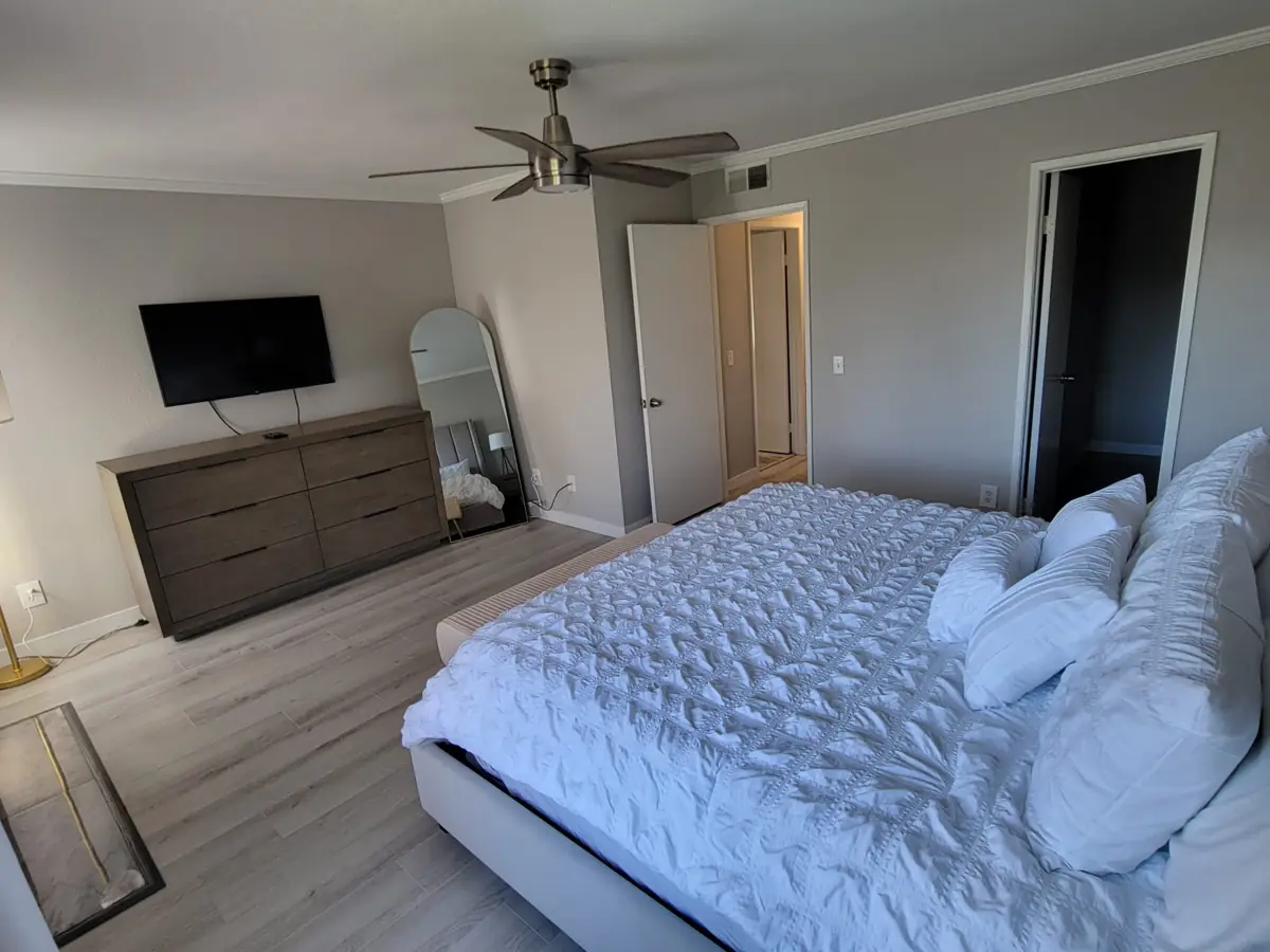 Bedroom with a made bed after cleaning