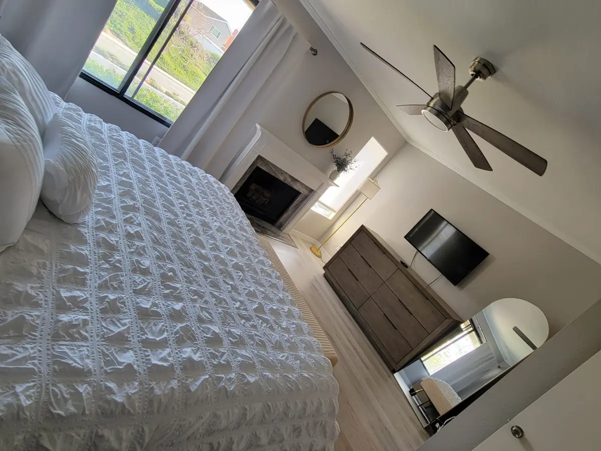 Bedroom with a made bed after cleaning