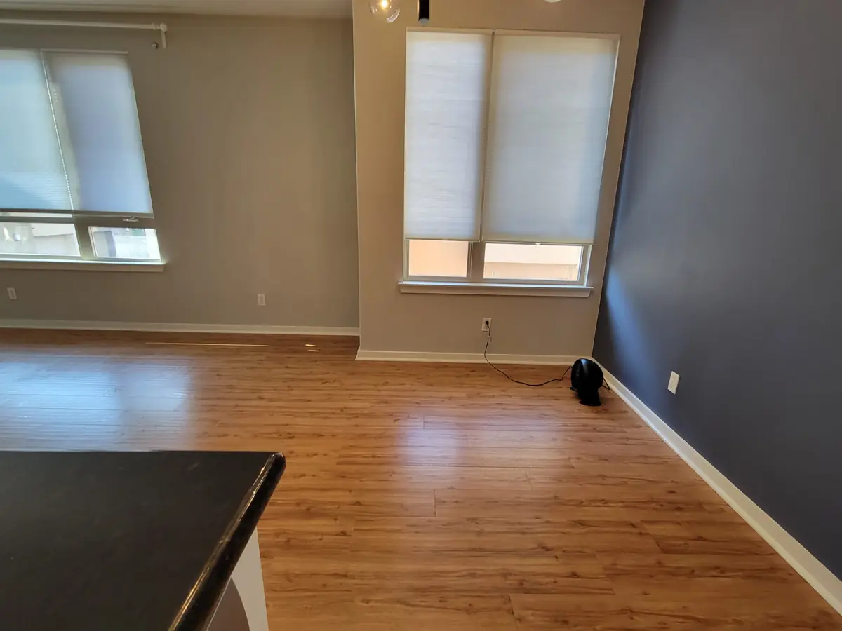 Empty living room with clean wood floors after a move-out cleaning in Santa Ana