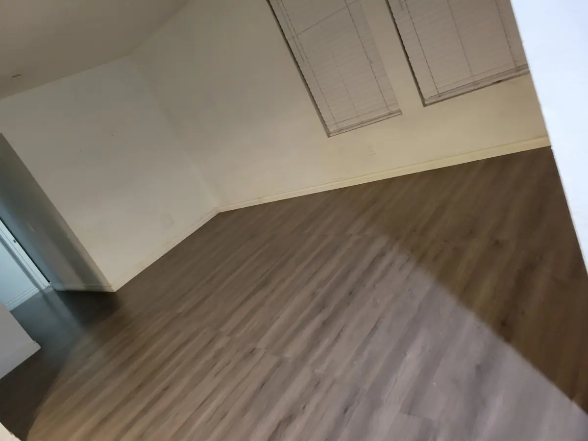 Empty room with clean floors after a cleaning by Sofia's House Cleaning in Santa Ana