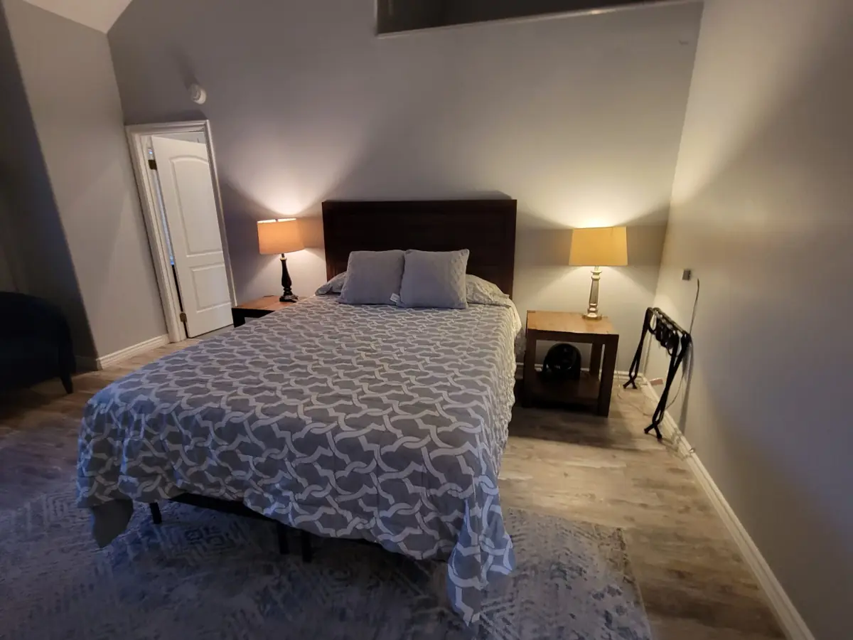 Guest bedroom with a made bed, ready for the next stay, in a Santa Ana rental