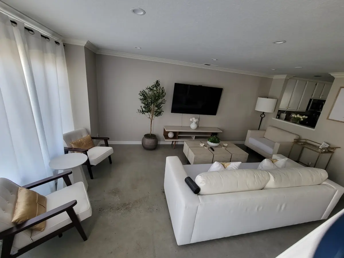 Living room with a white sofa after cleaning