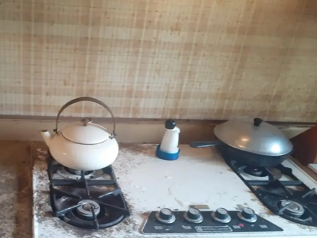 Gas stovetop in a Santa Ana kitchen before cleaning